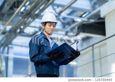 A male engineer performing building maintenance. Photo courtesy of Denpa Gakuen Tokyo Electronics College. A male engineer performing building maintenance. Photo courtesy of Denpa Gakuen Tokyo Electronics College. 126780493