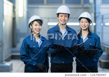 Male and female engineers maintaining a building. Photo courtesy of Denpa Gakuen Tokyo Electronics College. Male and female engineers maintaining a building. Photo courtesy of Denpa Gakuen Tokyo Electronics College. 126780497