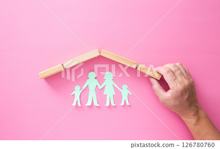 Paper cutout of family (father, mother, son and daughter). Life insurance concept. Paper cutout of family (father, mother, son and daughter). Life insurance concept. 126780760