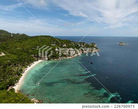 A scenic sandy beach with turquoise water and green hills in the backdrop. Thailand, Koh Tao. A scenic sandy beach with turquoise water and green hills in the backdrop. Thailand, Koh Tao. 126780973