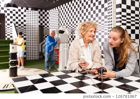 Grandparents and grandkids in escape room 126781067