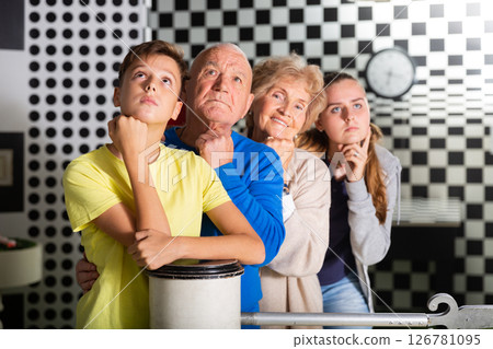 Group photo of grandparents and grandchildren in escape room 126781095