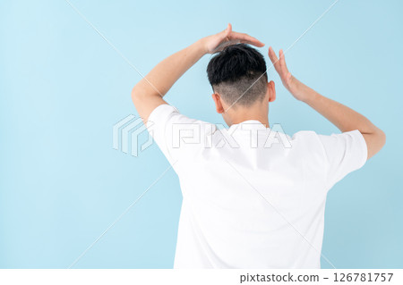 Young man hair care back view Young man hair care back view 126781757