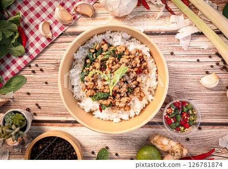 The Pork with basil in paper Bowl for Thai food concept. The Pork with basil in paper Bowl for Thai food concept. 126781874