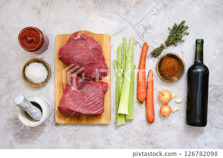 Fresh ingredients laid out for a flavorful beef stew preparation at a kitchen counter Fresh ingredients laid out for a flavorful beef stew preparation at a kitchen counter 126782098