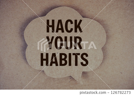 Hack Your Habits text with speech bubble on paper craft background 126782273