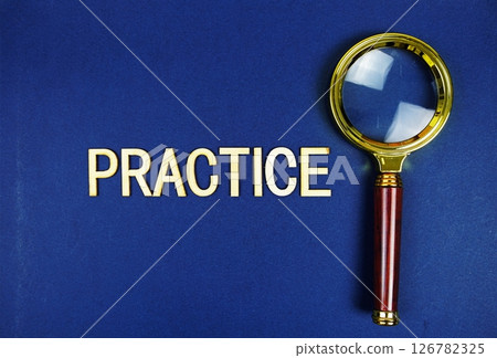 Practice alphabet letters with magnifying glass on navy blue background Practice alphabet letters with magnifying glass on navy blue background 126782325