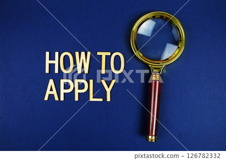 How to Apply alphabet letters with magnifying glass on navy blue background 126782332