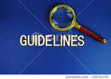 Guidelines alphabet letters with magnifying glass on navy blue background Guidelines alphabet letters with magnifying glass on navy blue background 126782350
