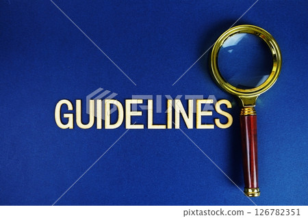 Guidelines alphabet letters with magnifying glass on navy blue background Guidelines alphabet letters with magnifying glass on navy blue background 126782351