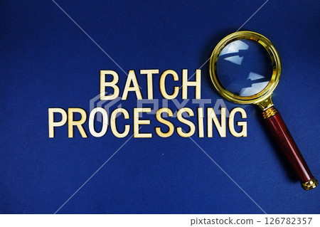 Batch Processing alphabet letters with magnifying glass on navy blue background Batch Processing alphabet letters with magnifying glass on navy blue background 126782357