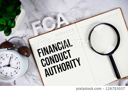 FCA - Financial Conduct Authority acronym on notepad, Business concept background FCA - Financial Conduct Authority acronym on notepad, Business concept background 126783037