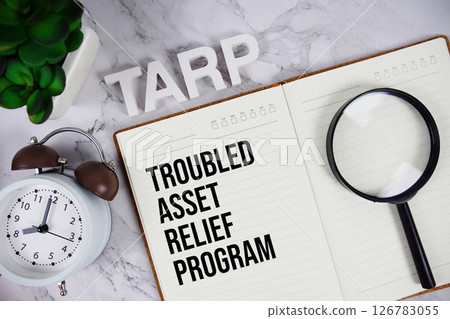 TARP - Troubled Asset Relief Program acronym on notepad, Business concept background TARP - Troubled Asset Relief Program acronym on notepad, Business concept background 126783055