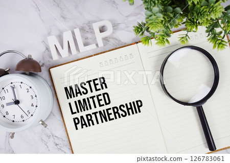MLP - Master Limited Partnership acronym on notepad, Business concept background 126783061