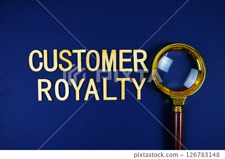 Customer Royalty alphabet letters with magnifying glass on navy blue background 126783148