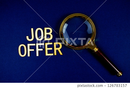 Job Offer alphabet letters with magnifying glass on navy blue background 126783157
