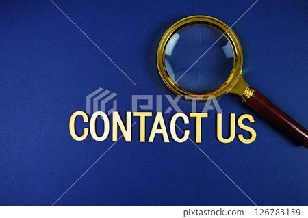 Contact Us alphabet letters with magnifying glass on navy blue background 126783159