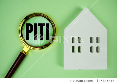 PITI Principal, Interest, Taxes And Insurance text with house model on green background PITI Principal, Interest, Taxes And Insurance text with house model on green background 126783232