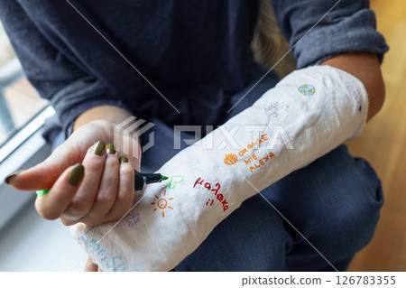 Fun creative fun to draw on plaster cast on broken arm Fun creative fun to draw on plaster cast on broken arm 126783355