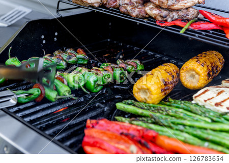 Grilling chicken, corn cobs, paprika, padron, asparagus. 126783654