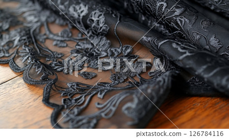 Black lace fabric with floral pattern texture used for fashion and design 126784116