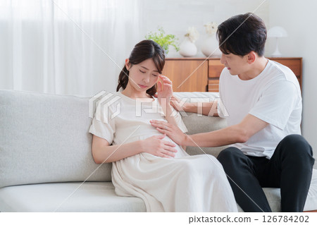 A husband encouraging his pregnant wife who is suffering from maternity blues A husband encouraging his pregnant wife who is suffering from maternity blues 126784202