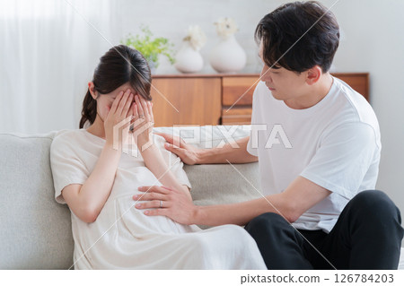 A husband encouraging his pregnant wife who is suffering from maternity blues A husband encouraging his pregnant wife who is suffering from maternity blues 126784203