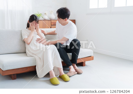 A husband encouraging his pregnant wife who is suffering from maternity blues A husband encouraging his pregnant wife who is suffering from maternity blues 126784204