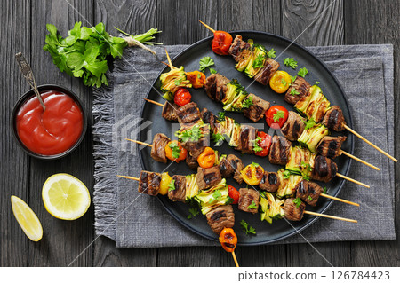beef kebabs with zucchini and tomatoes on skewers beef kebabs with zucchini and tomatoes on skewers 126784423