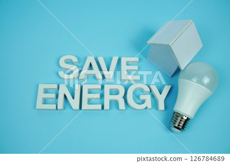Save Energy alphabet letters with house model and LED light bulbs on blue background, Saving and Eco friendly concept 126784689