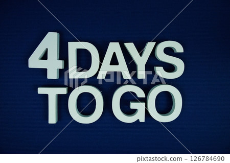 4 Days to go alphabet letters top view on navy blue background 4 Days to go alphabet letters top view on navy blue background 126784690