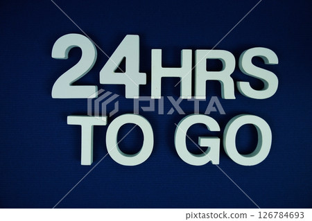 24 Hrs to go alphabet letters top view on navy blue background 24 Hrs to go alphabet letters top view on navy blue background 126784693