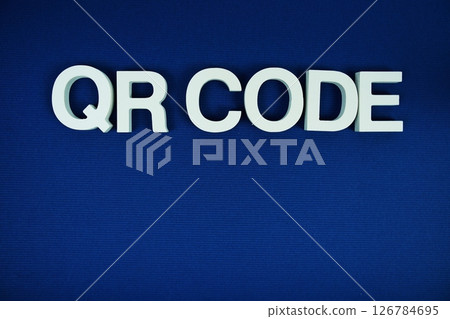 QR Code alphabet letters with space for text top view on navy blue background QR Code alphabet letters with space for text top view on navy blue background 126784695