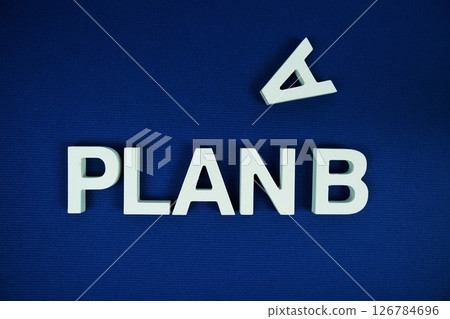 Plan B alphabet letters top view on navy blue background Plan B alphabet letters top view on navy blue background 126784696