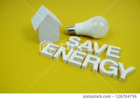 Save Energy alphabet letters with house model and LED light bulbs on yellow background, Saving and Eco friendly concept Save Energy alphabet letters with house model and LED light bulbs on yellow background, Saving and Eco friendly concept 126784736