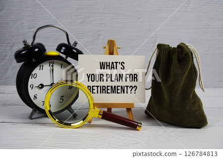 What's Your Plan For Retirement? text with alarm clock and magnifying glass on wooden background What's Your Plan For Retirement? text with alarm clock and magnifying glass on wooden background 126784813