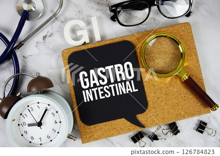 GI - Gastrointestinal acronym with stethoscope, magnifying glass and alarm clock, medical and healthcare concept background 126784823