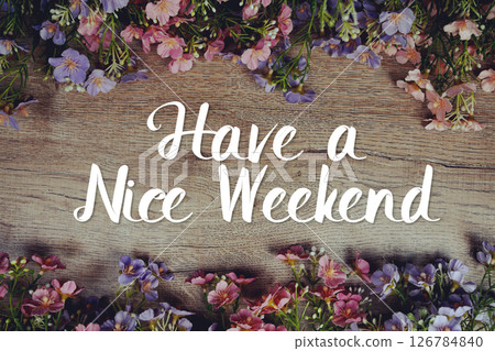 Have a Nice Weekend text message with flowers decoration on wooden background Have a Nice Weekend text message with flowers decoration on wooden background 126784840