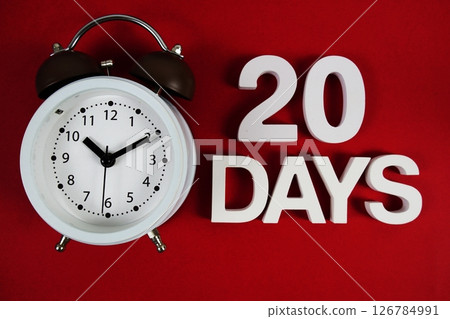 20 Days alphabet letters with alarm clock on red background 20 Days alphabet letters with alarm clock on red background 126784991