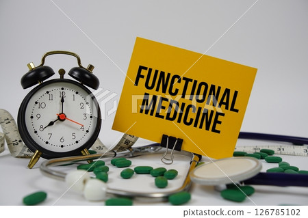 Functional Medicine text with alarm clock and measuring tape on white background Functional Medicine text with alarm clock and measuring tape on white background 126785102