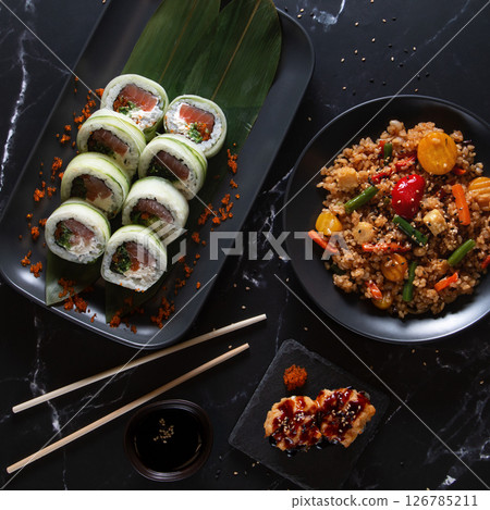 Cucumber Wrapped Sushi Rolls with Stir Fry and Appetizer Cucumber Wrapped Sushi Rolls with Stir Fry and Appetizer 126785211