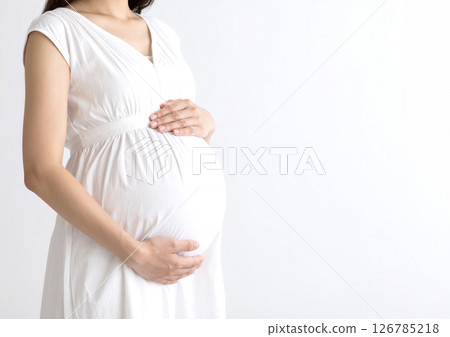 AI-generated image of a faceless pregnant woman wearing a white dress and a white background AI-generated image of a faceless pregnant woman wearing a white dress and a white background 126785218