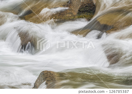 Water flowing vigorously down the weir, Takano River, Kyoto City Water flowing vigorously down the weir, Takano River, Kyoto City 126785387