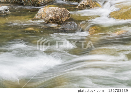 Water flowing vigorously down the weir, Takano River, Kyoto City Water flowing vigorously down the weir, Takano River, Kyoto City 126785389