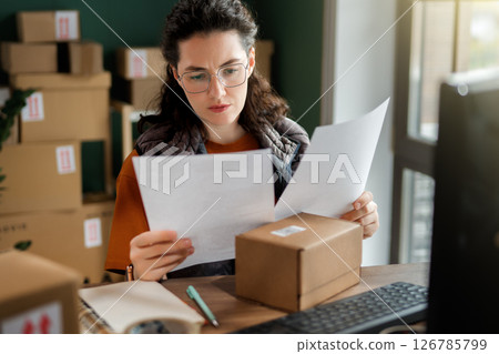 Woman working in a warehouse Woman working in a warehouse 126785799