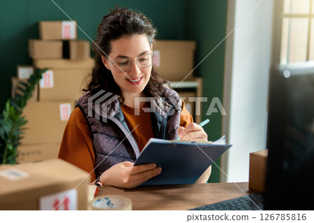 Woman working in a warehouse 126785816