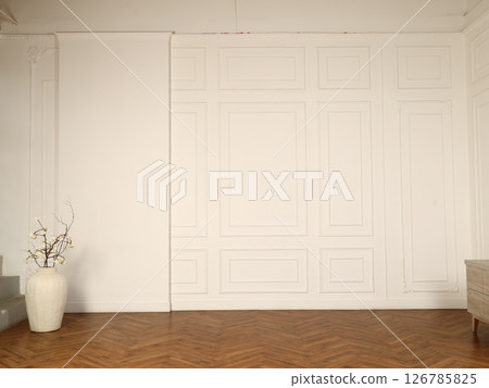 An Elegant Minimalist Interior Featuring White Walls and Wooden Flooring for a Chic Appeal 126785825