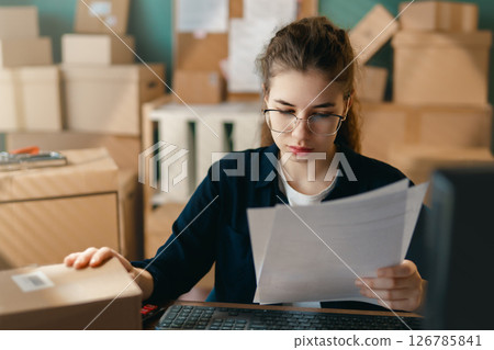 Woman working in a warehouse 126785841