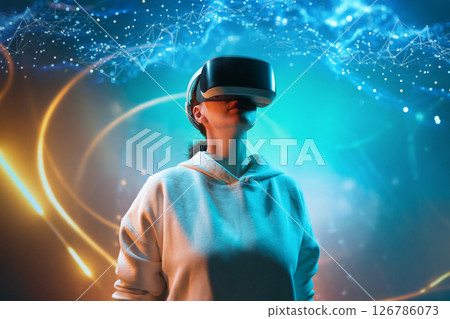 Woman with VR virtual reality goggles 126786073