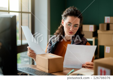 Woman working in a warehouse Woman working in a warehouse 126786076
